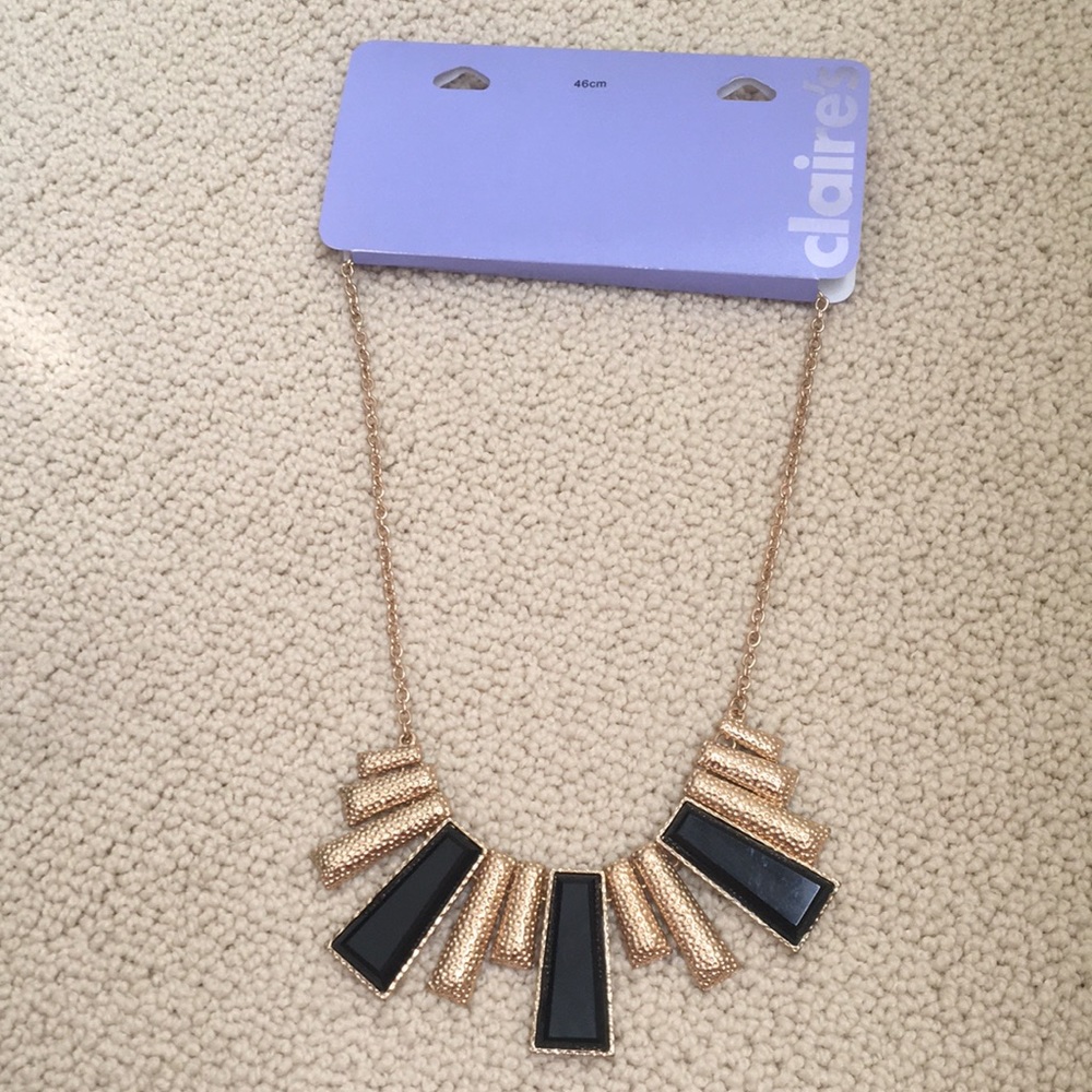 Claire’s necklace with black and gold detail